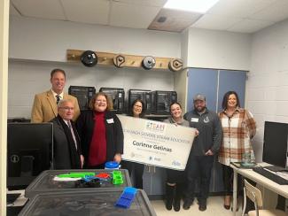 From left to right: Superintendent Joseph Goho, North Providence Mayor Charles Lombardi, RI Energy Manager of External Affairs Marisa Albanese, RI STEAM Center Director Dr. Lisa Bain, Corinne Gelinas, Timothy Gelinas, and North Providence High School Principal Christine Magill (RIDE).