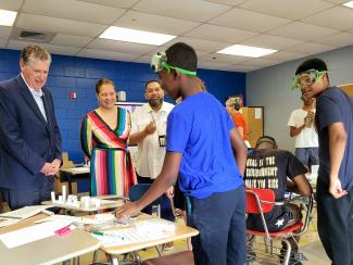 Governor Dan McKee, Commissioner Infante-Green, and Supt. Javier Montanez at a Providence Public Schools summer camp.