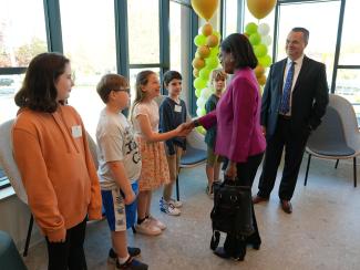 HHS Asst. Secretary Dr. Miriam Dellphin-Rittmon greets students at Garden City Elementary School on May 9, 2024. 